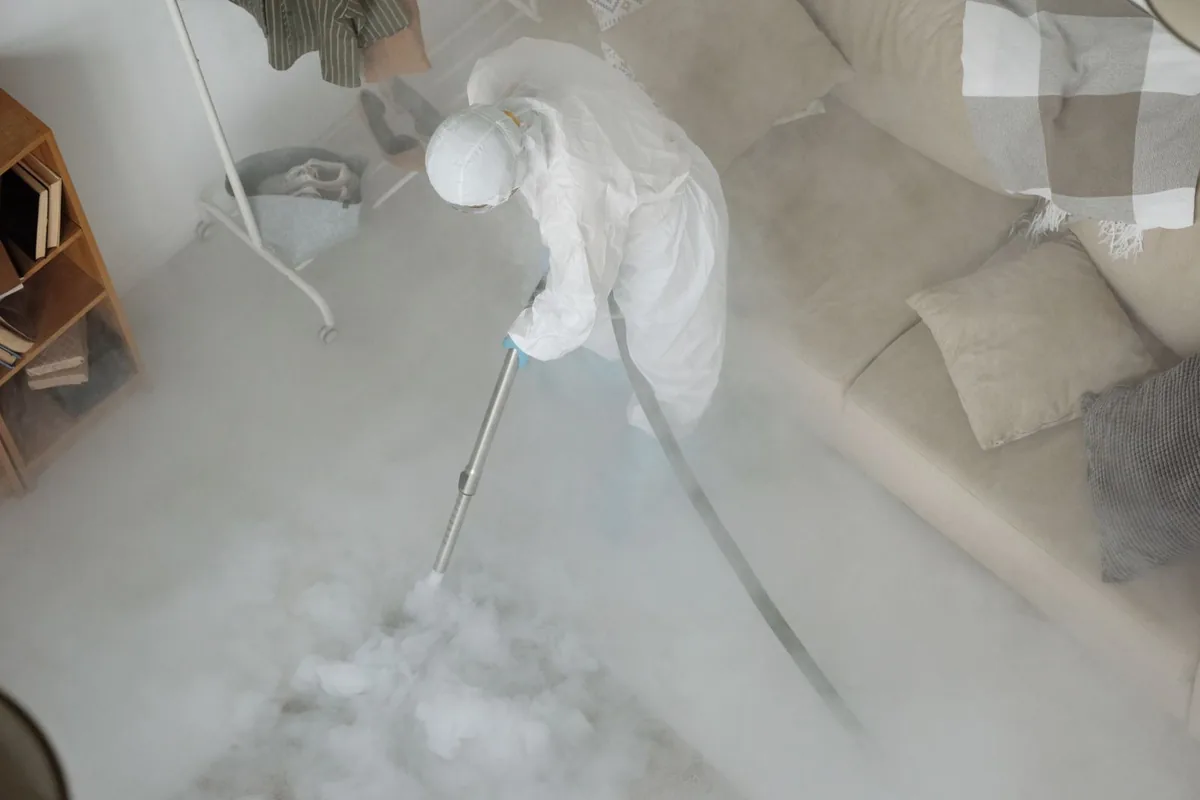 Biohazard cleanup technician in protective equipment, Arlington, GA
